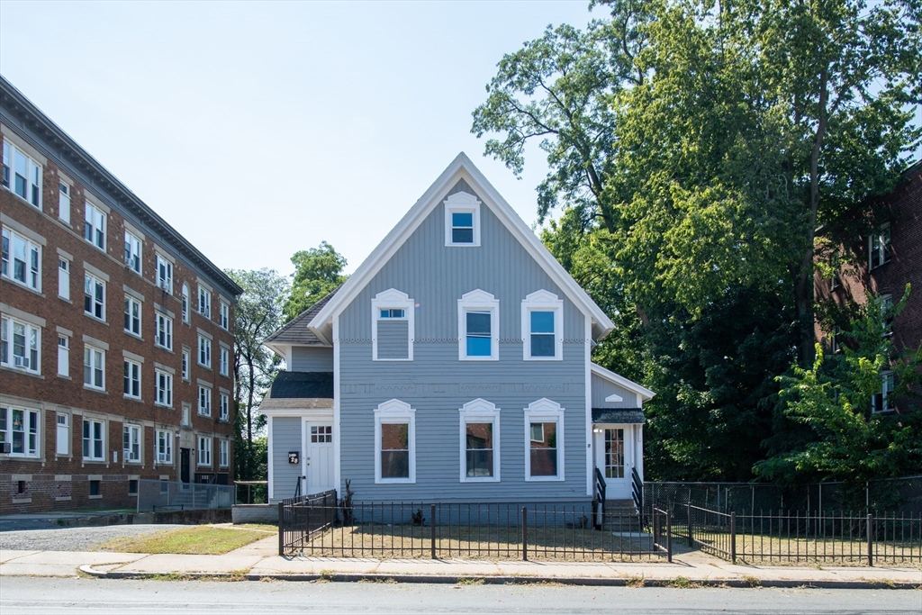 a front view of a house with a yard