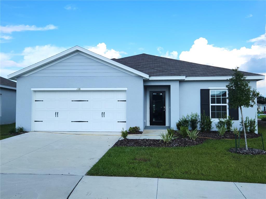 a front view of house with yard