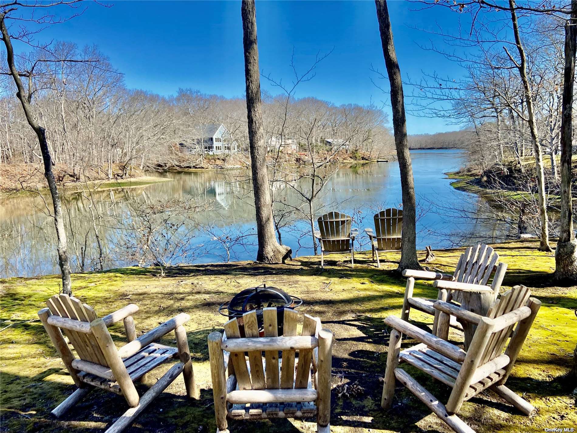 a view of a swimming pool with outdoor seating