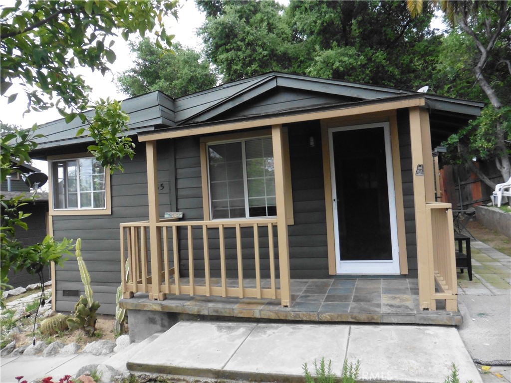 a front view of a house with a porch