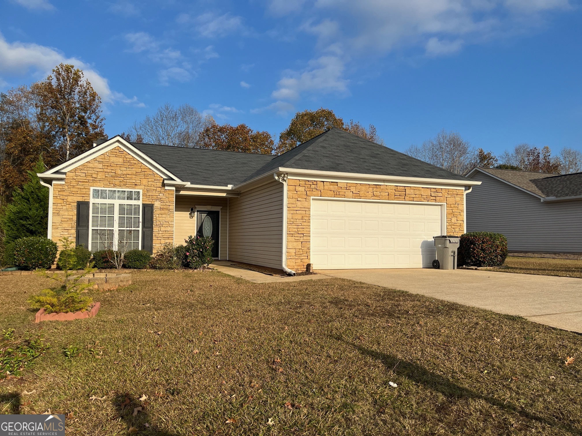 a front view of a house with a yard