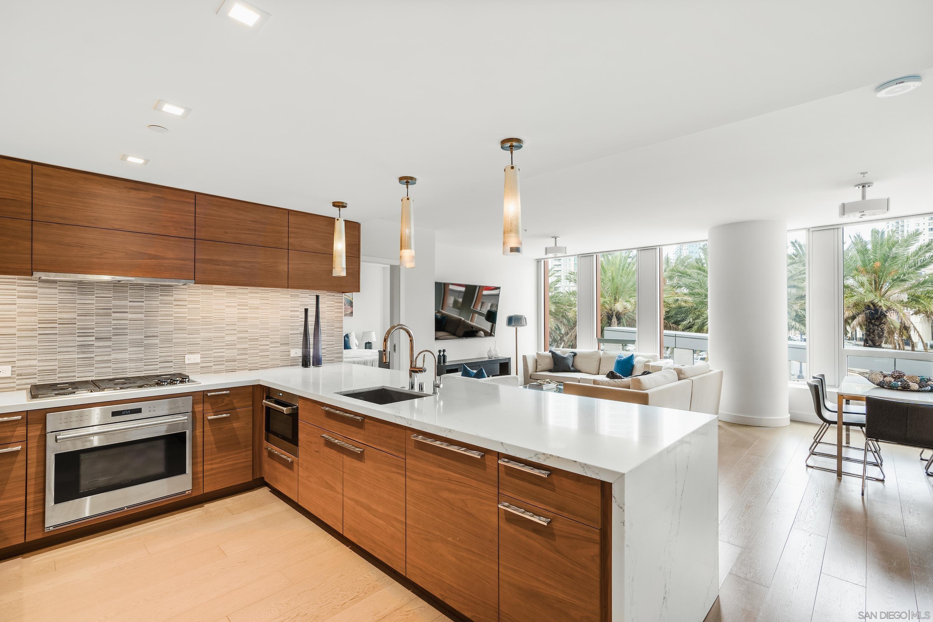 a kitchen with a sink stove and cabinets