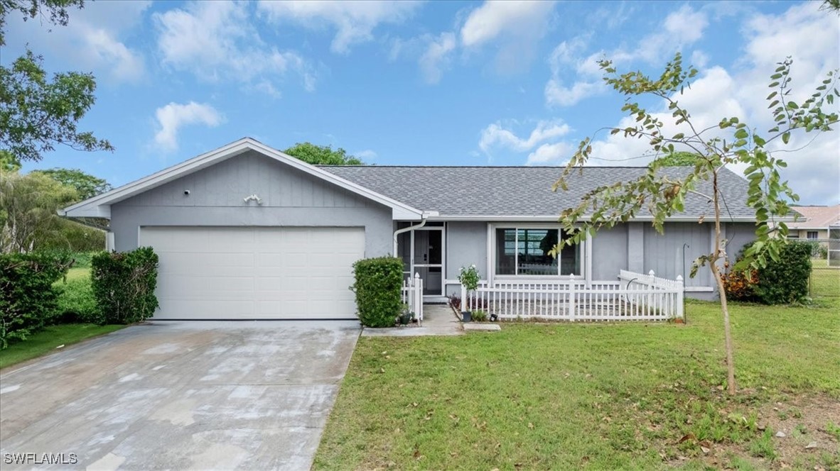 a front view of house with yard and outdoor seating