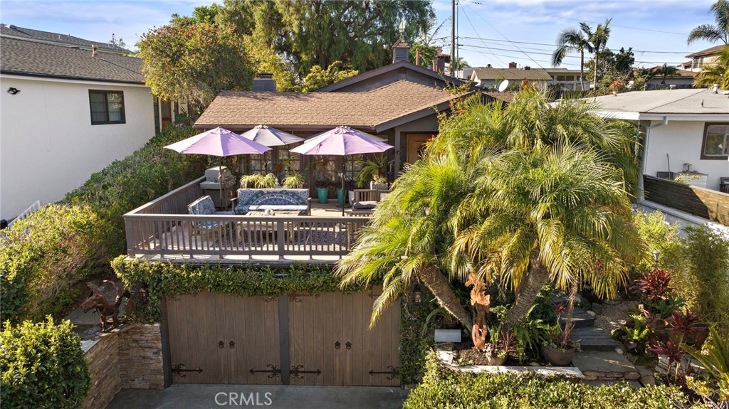 a front view of house with yard and outdoor seating