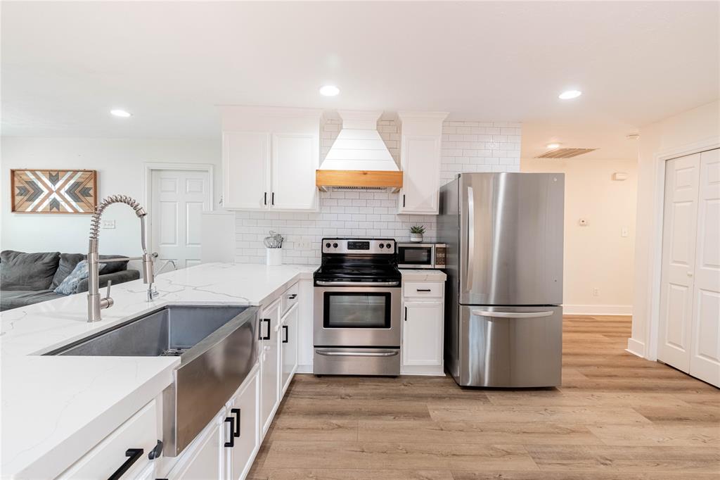 Another view of the upgraded kitchen, with quarts counter top and stainless steel appliance