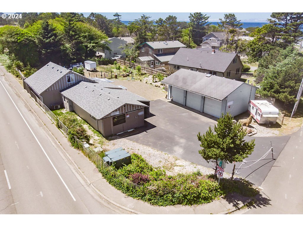 an aerial view of a house with a garden and mountain view