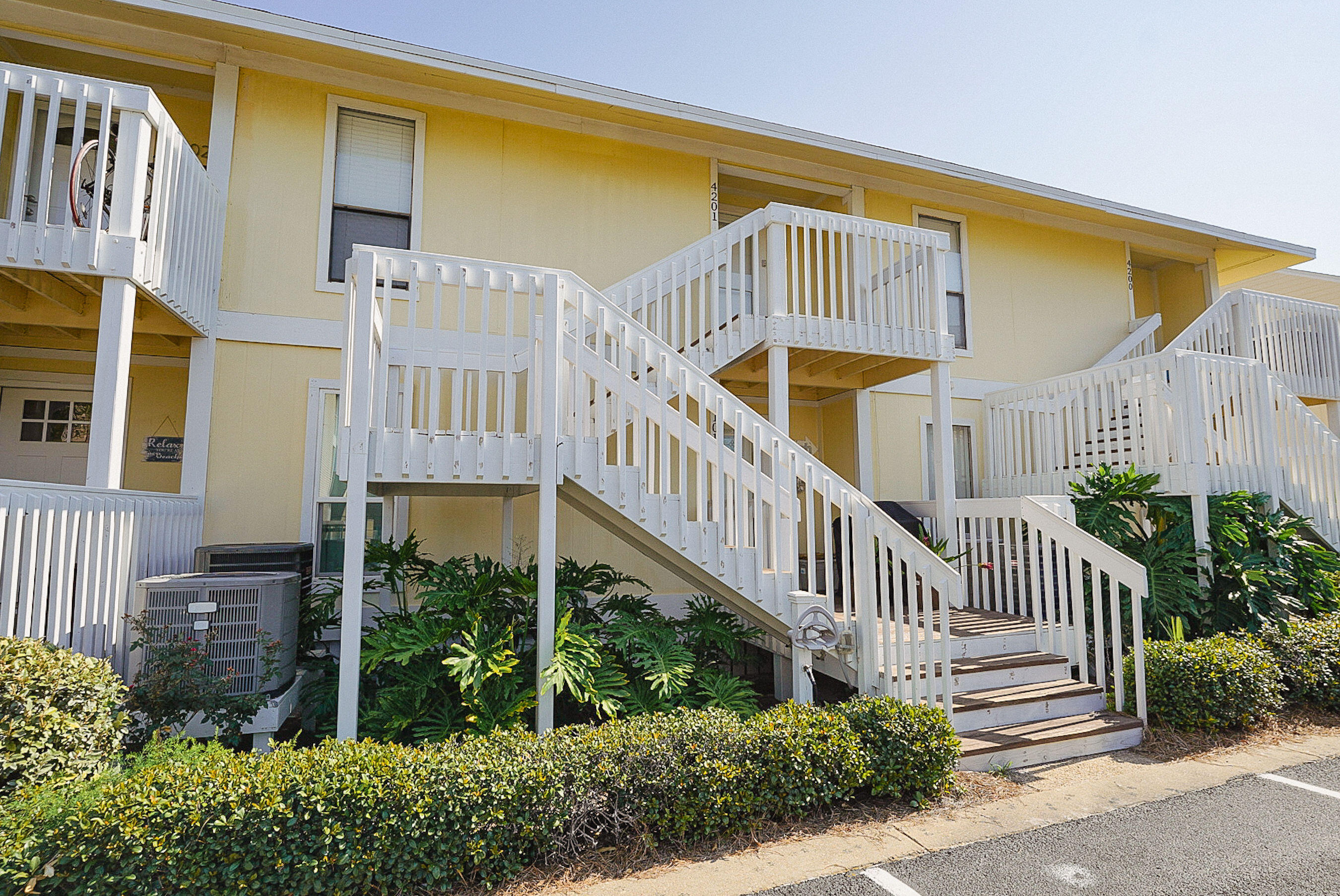 a view of a building with a small yard