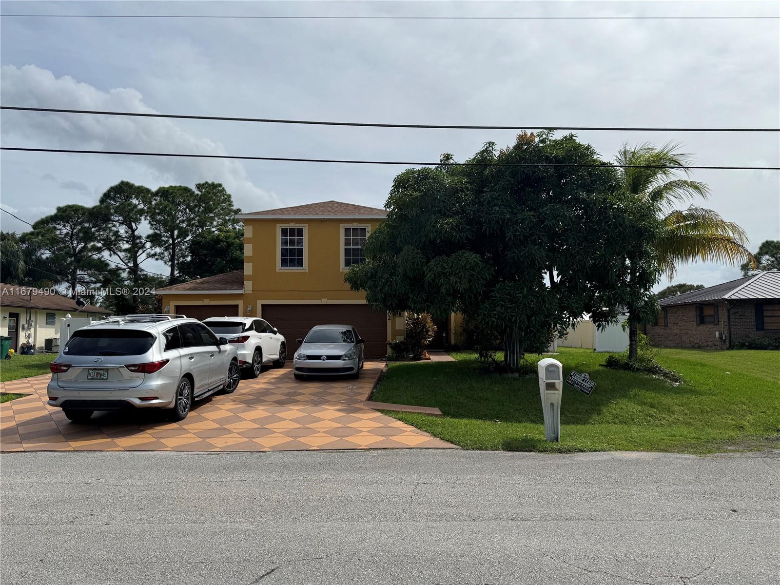 a view of a car parked in front of a house