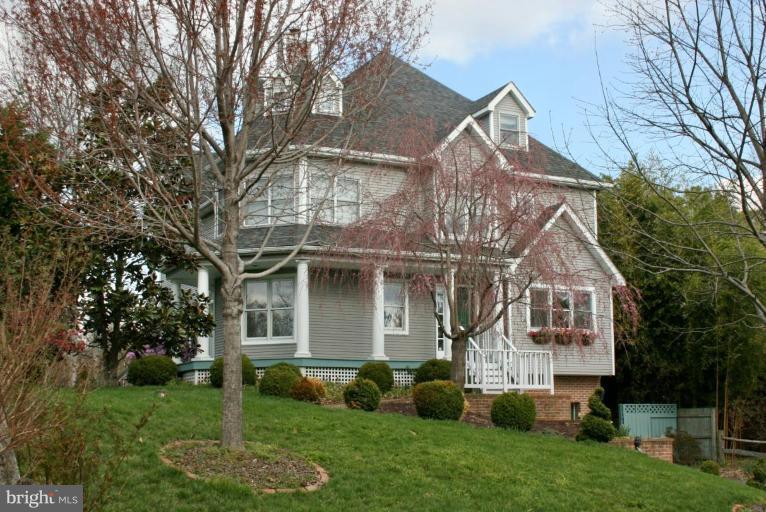 a front view of house with a garden