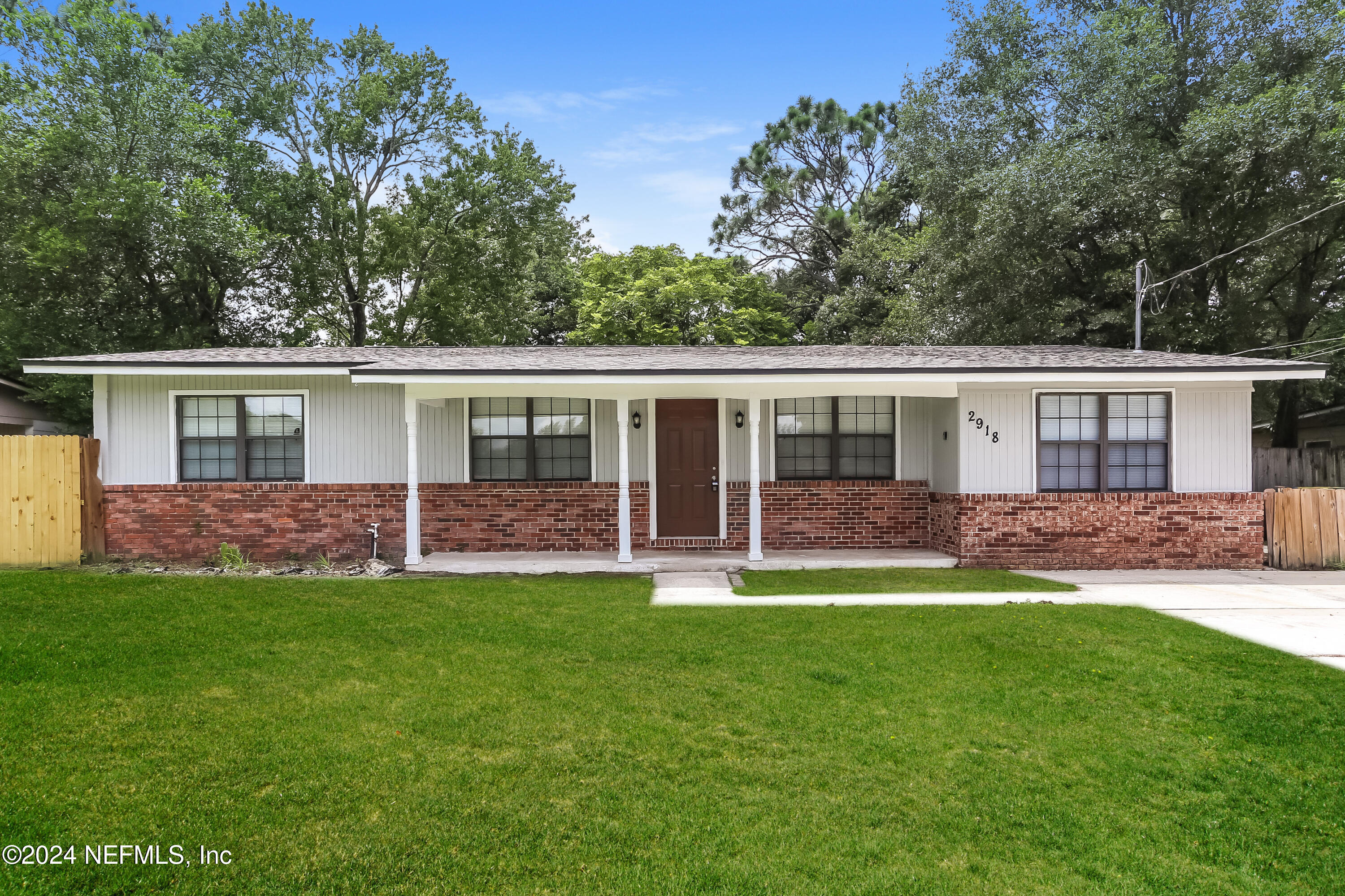 front view of a house with a yard