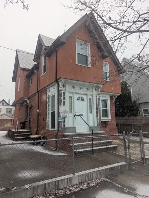 a front view of a house with stairs