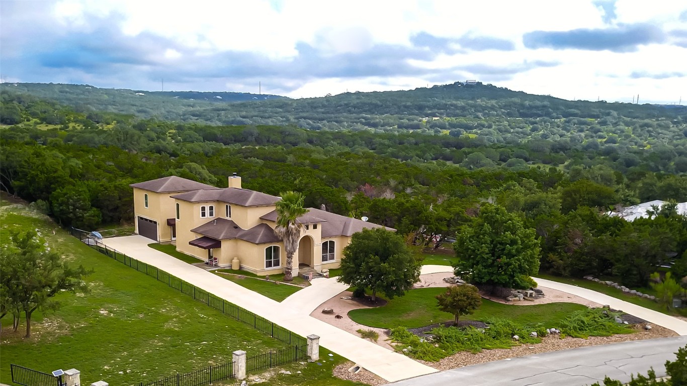 an aerial view of a house with a garden