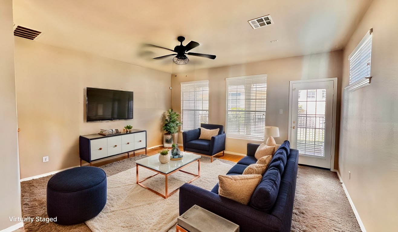 a living room with furniture and a flat screen tv