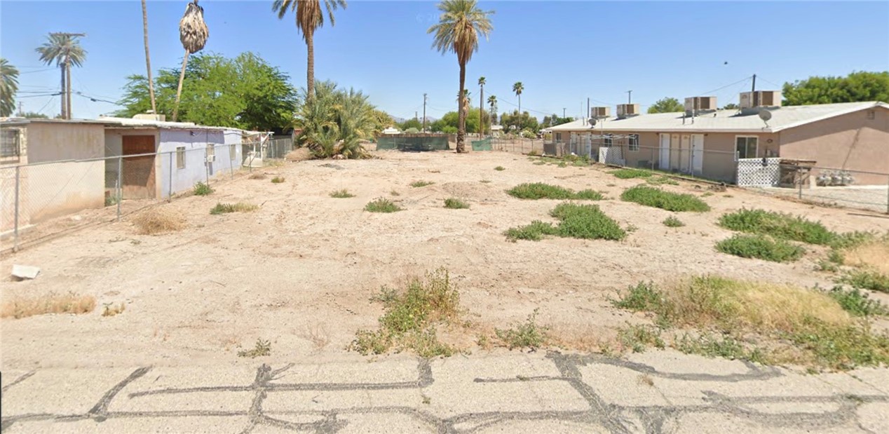 a view of a backyard of the house