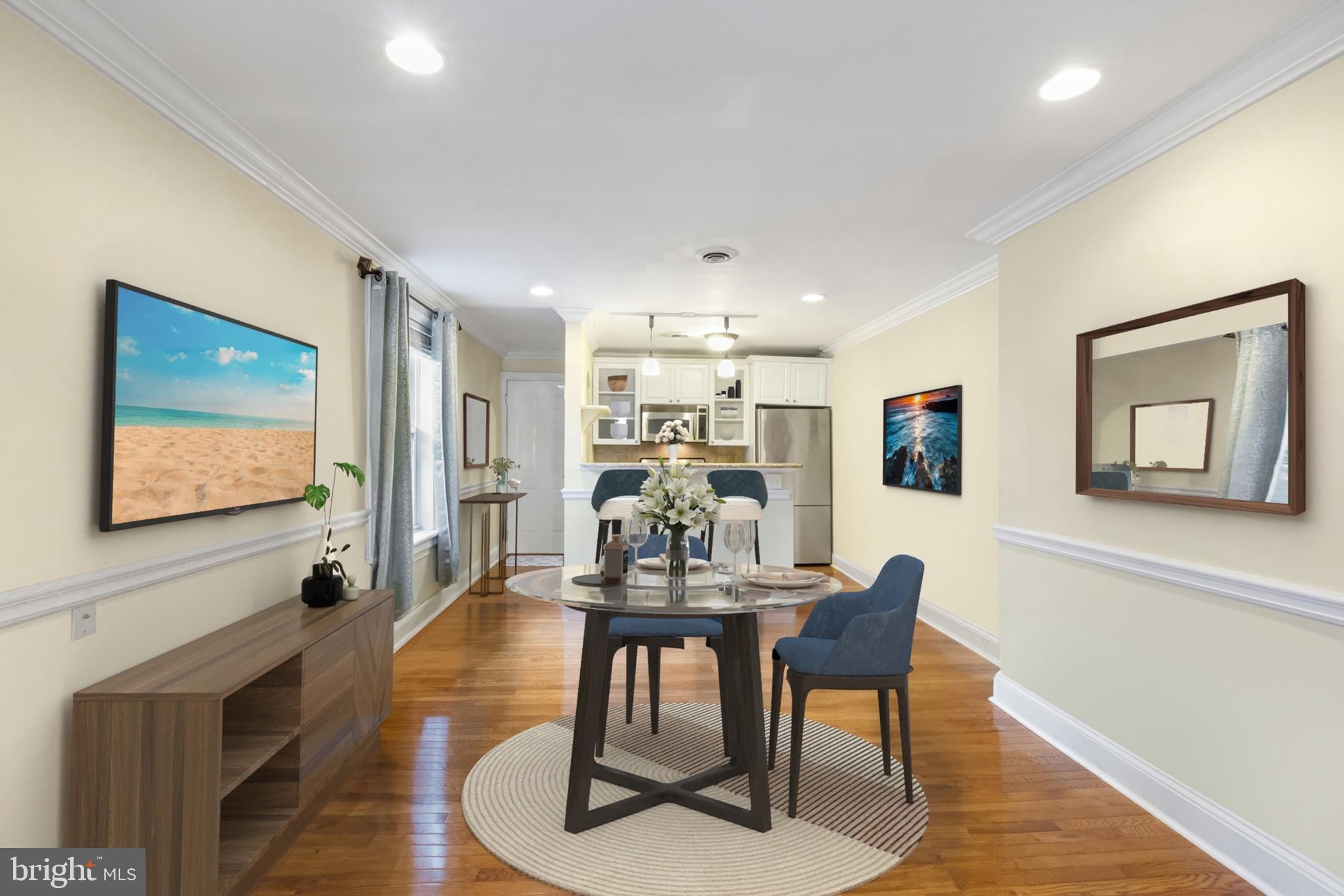 a view of a dining room with furniture window and wooden floor