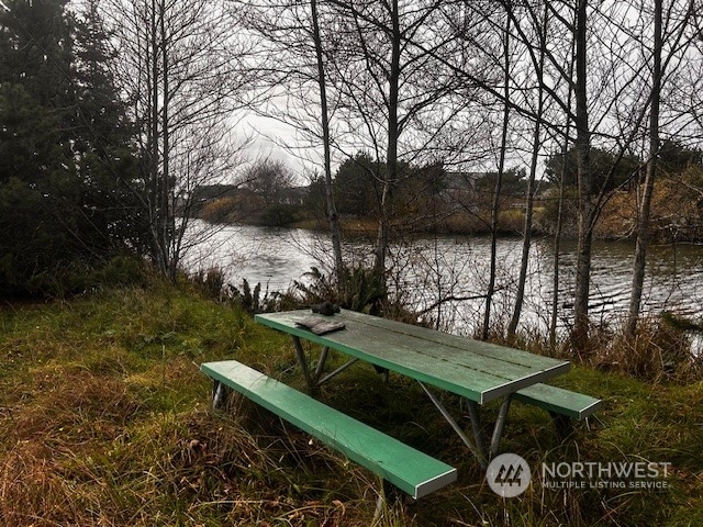 a view of backyard with seating area and green space