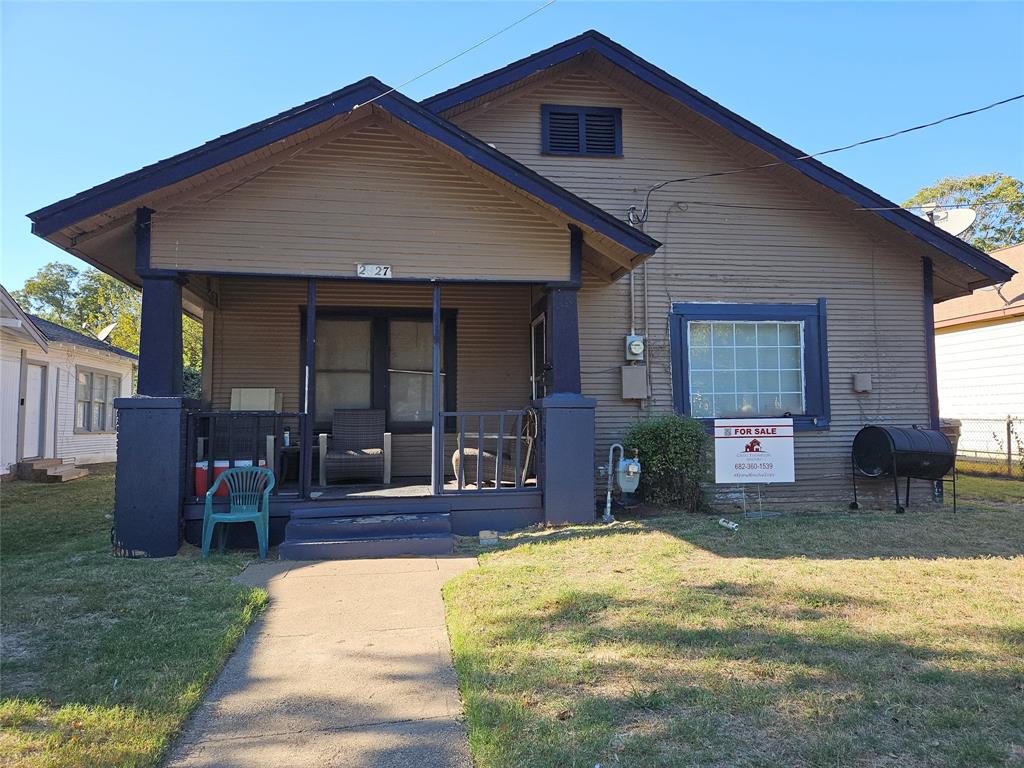 a front view of house with outdoor seating