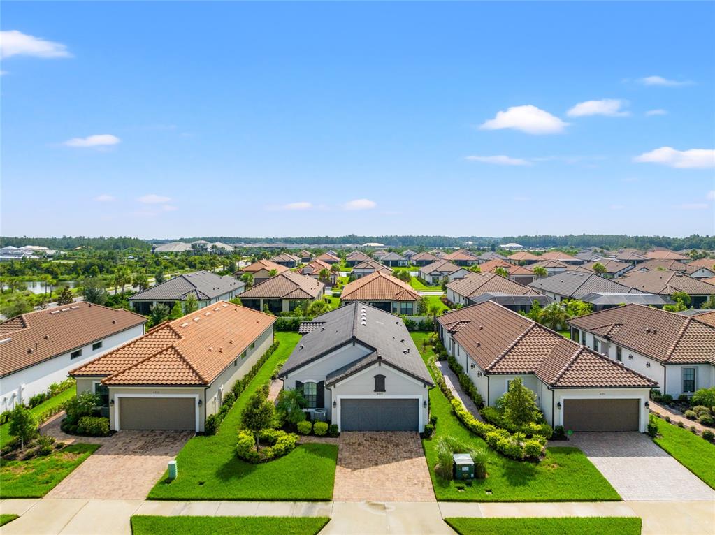 a aerial view of multiple houses with yard