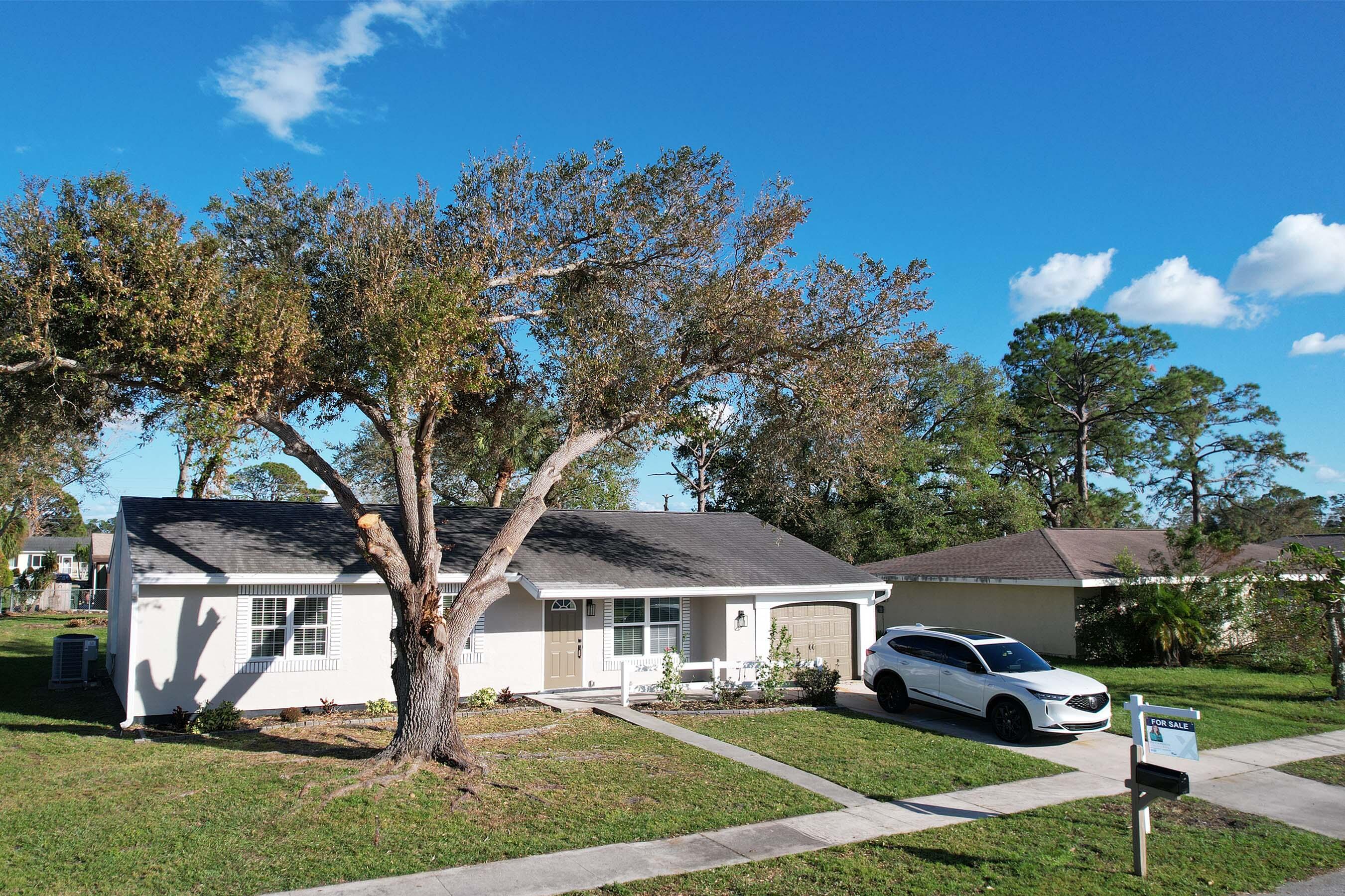 a front view of a house with a yard