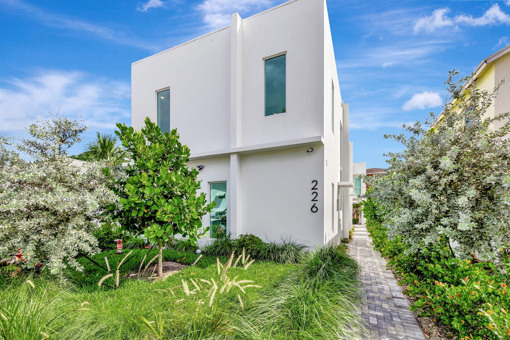 a view of a house with a yard