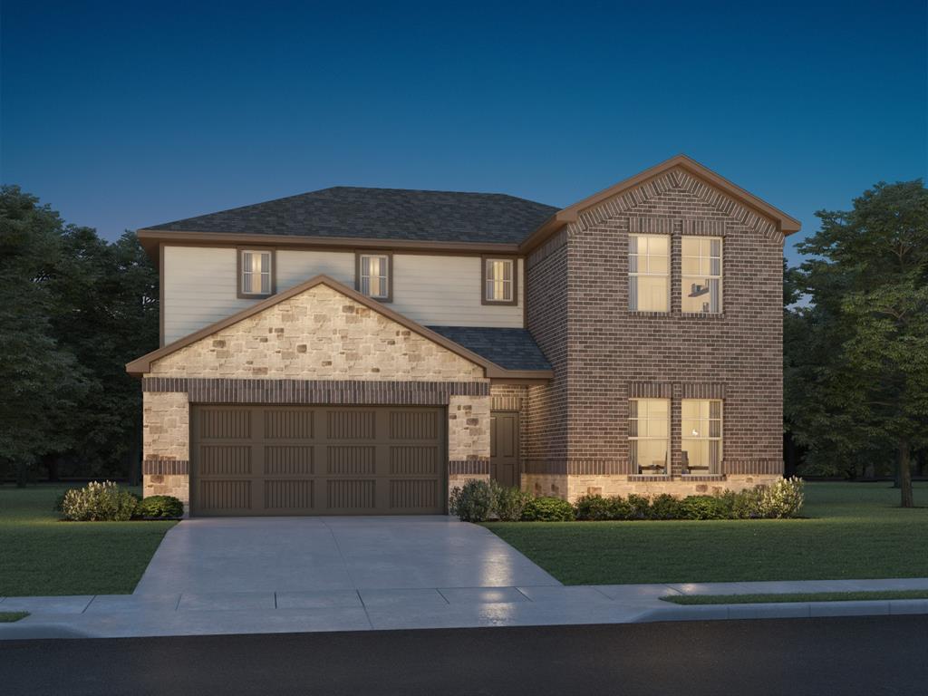 a front view of a house with a garden and garage