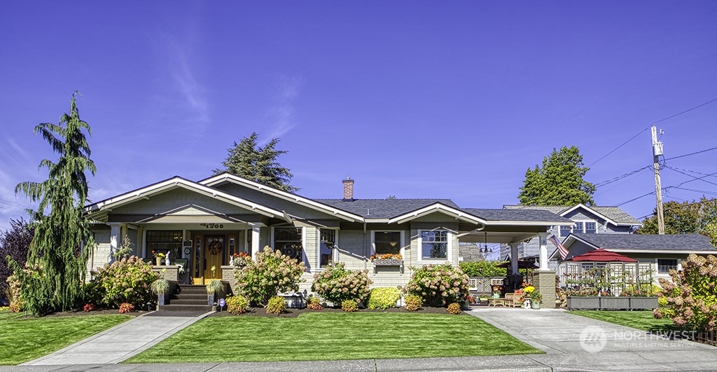 a front view of a house with garden