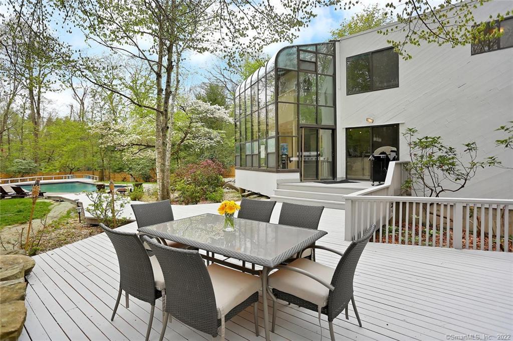 a view of a patio with a table and chairs