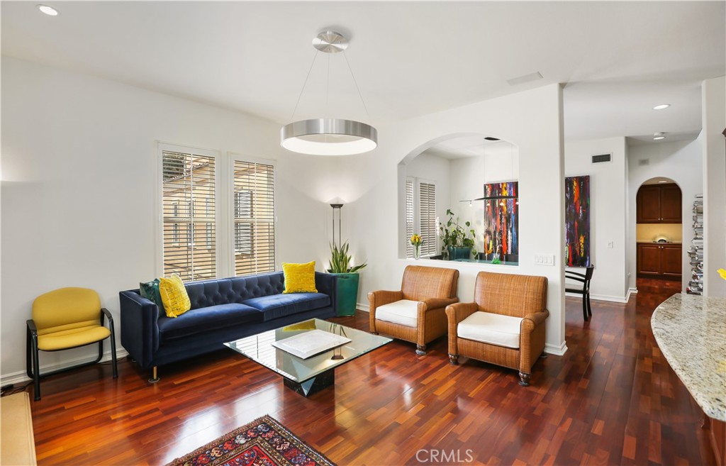 a living room with furniture rug and window