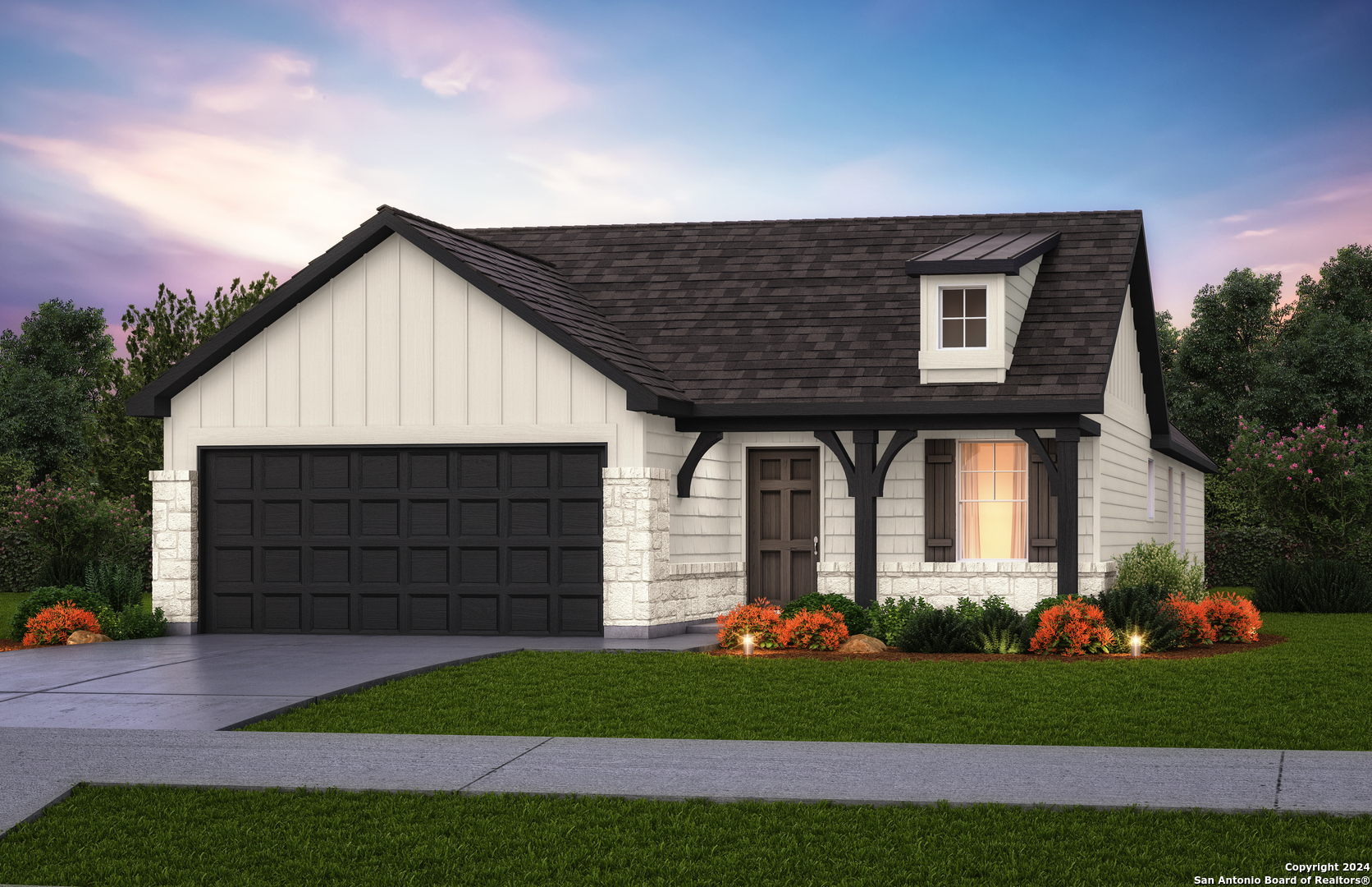 a front view of a house with a garden and garage