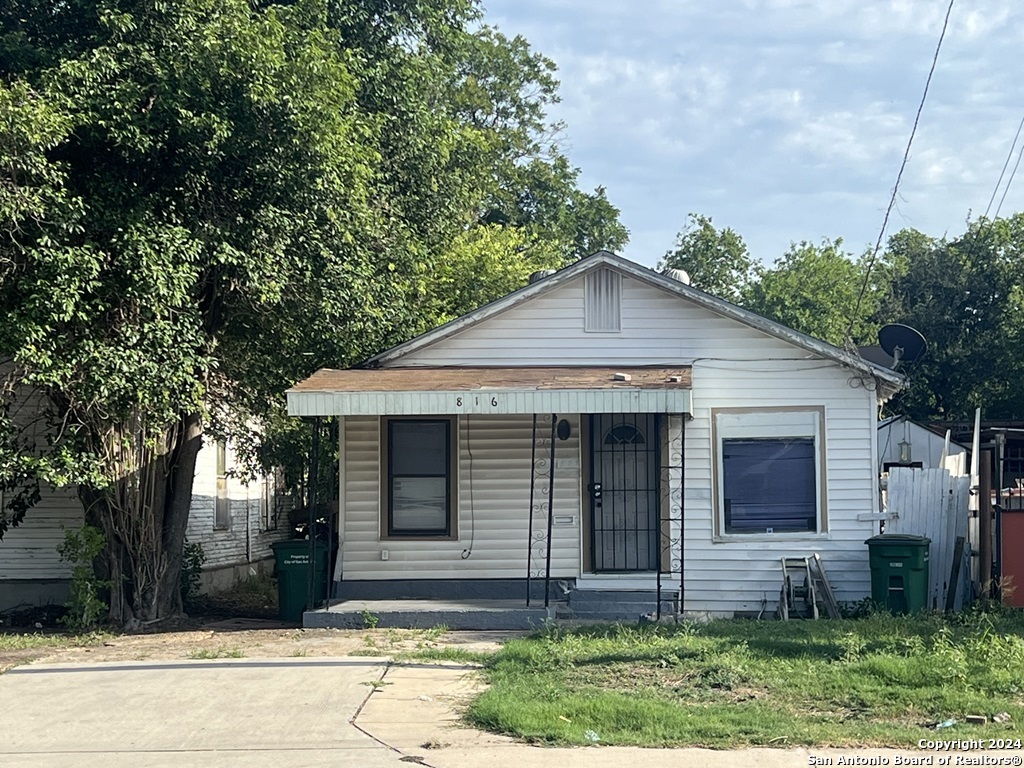 a view of a yard in front view of a house