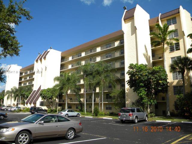 a view of cars parked in front of a building