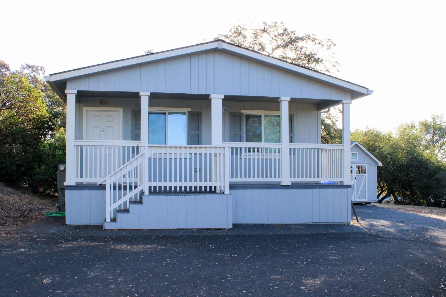 a view of a house with a fence