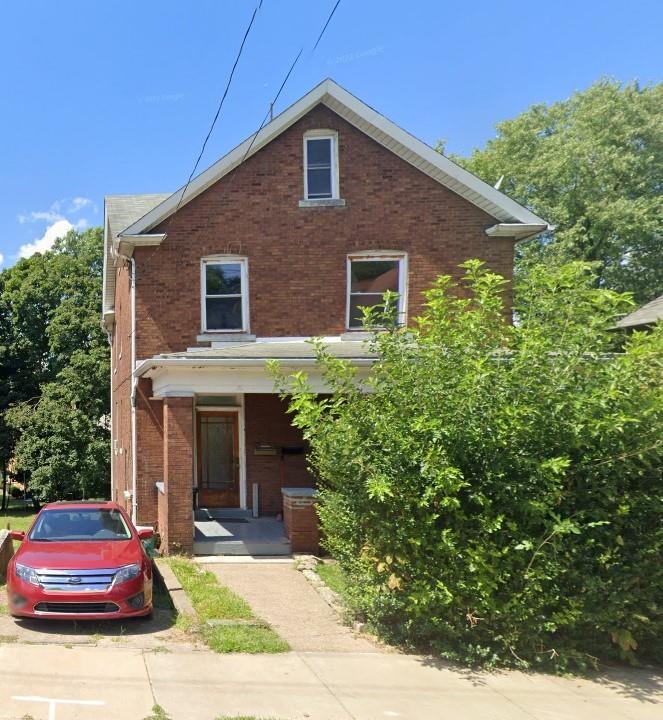 a front view of a house with yard