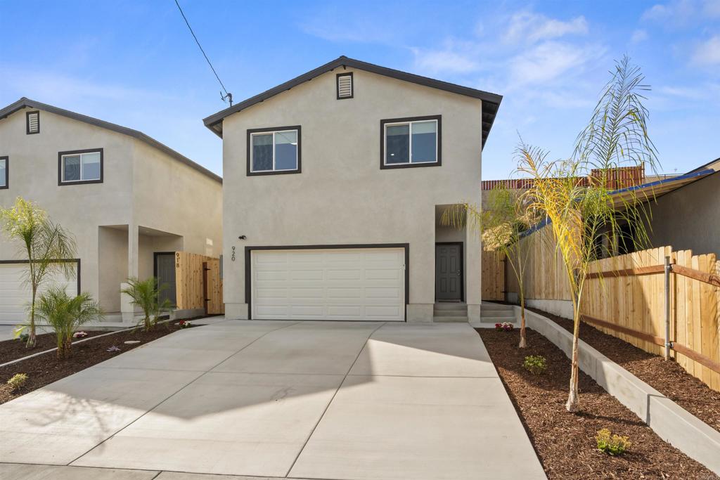 a front view of a house with garage