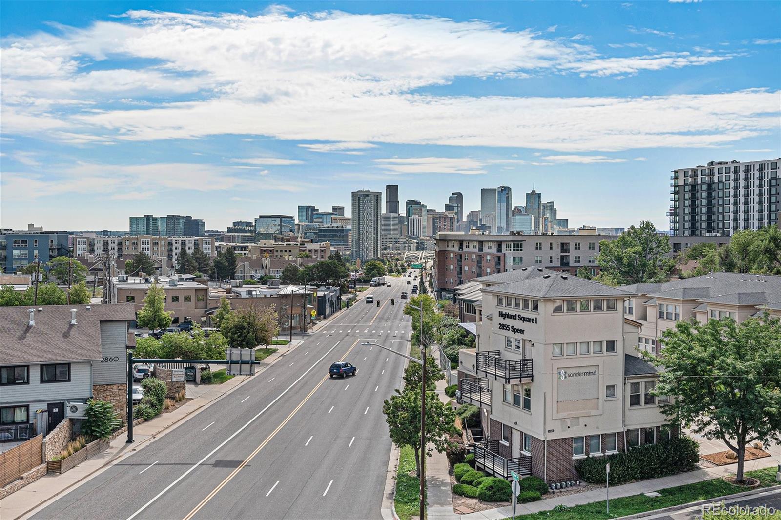 a view of a city with tall buildings