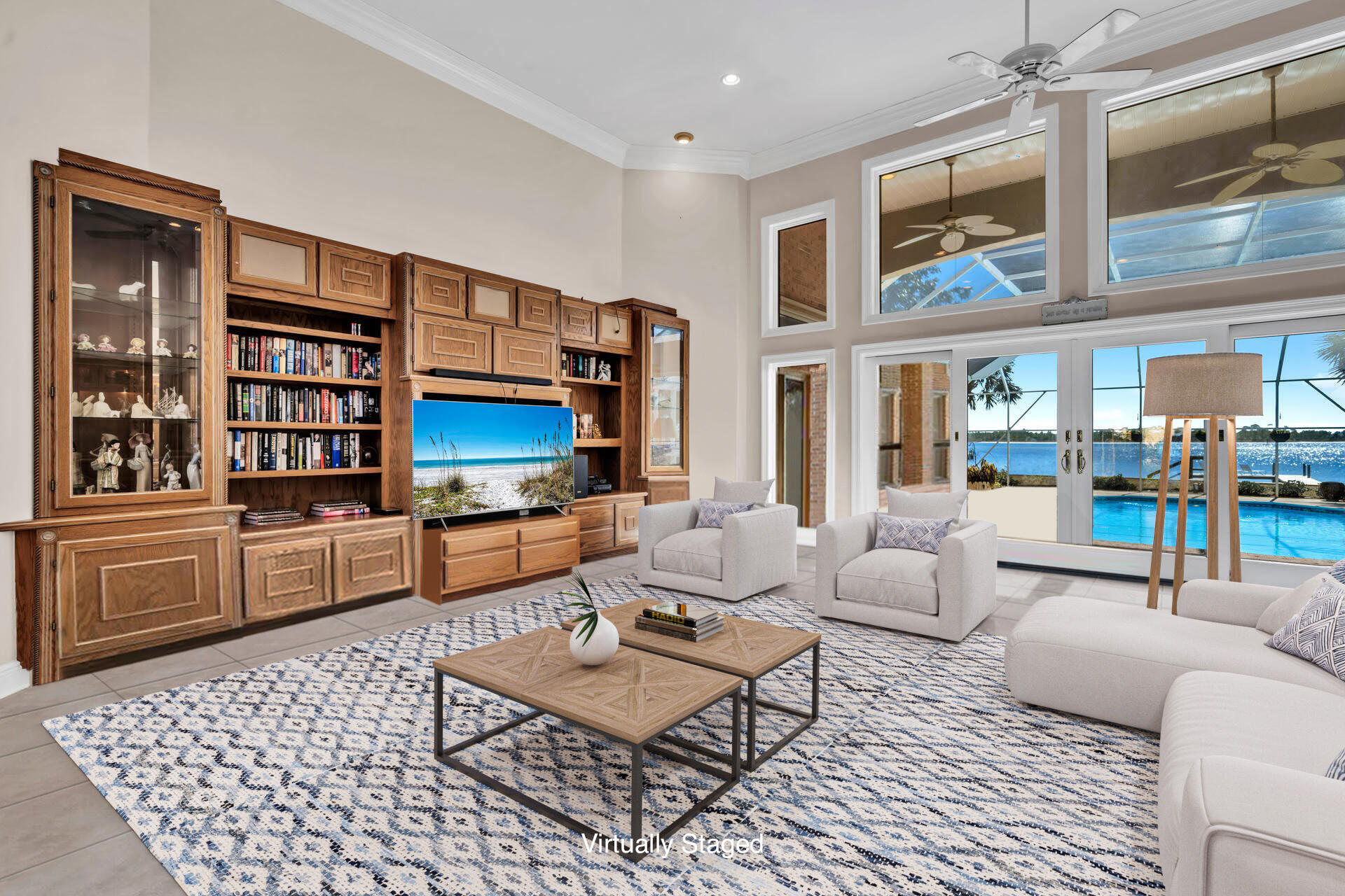 a living room with furniture a rug and a bookshelf