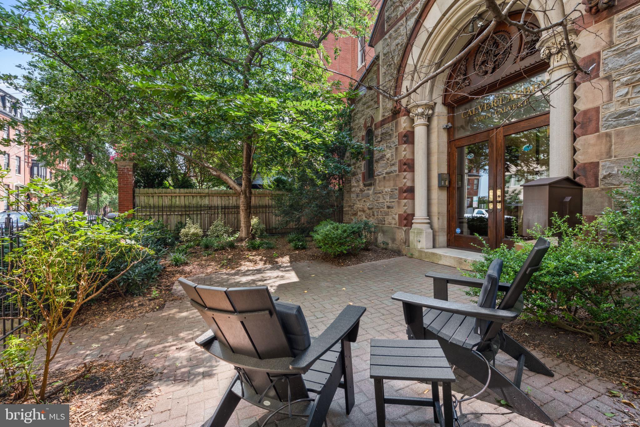 a view of a backyard with sitting area