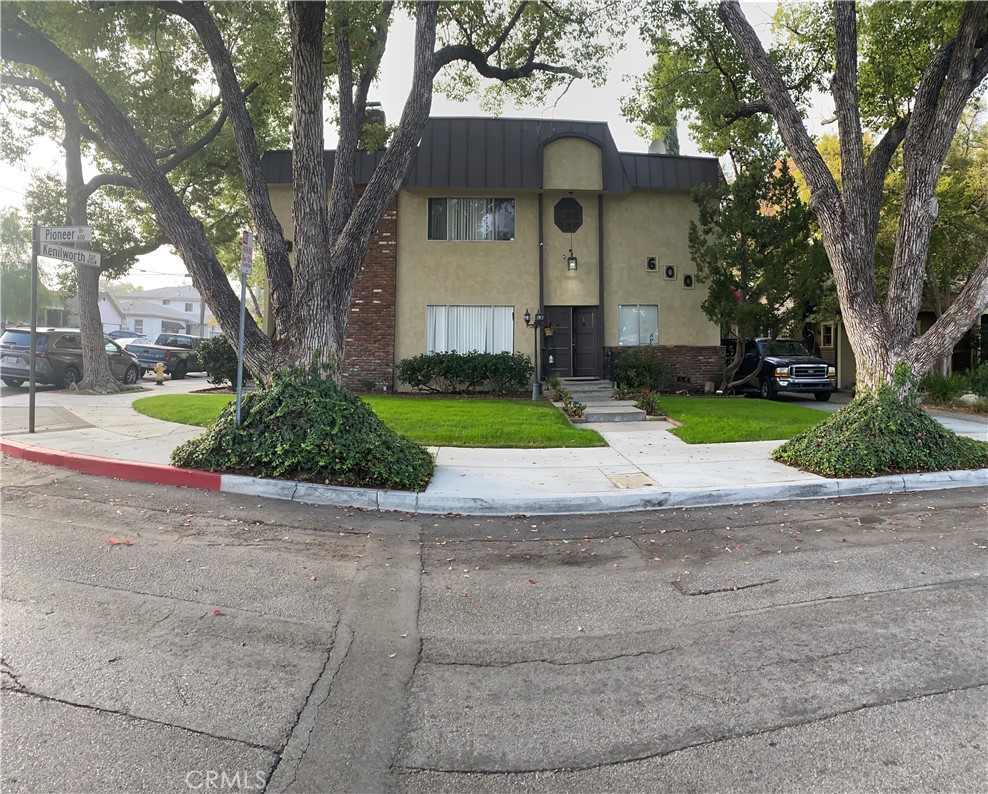 a front view of a house with a yard and a garage