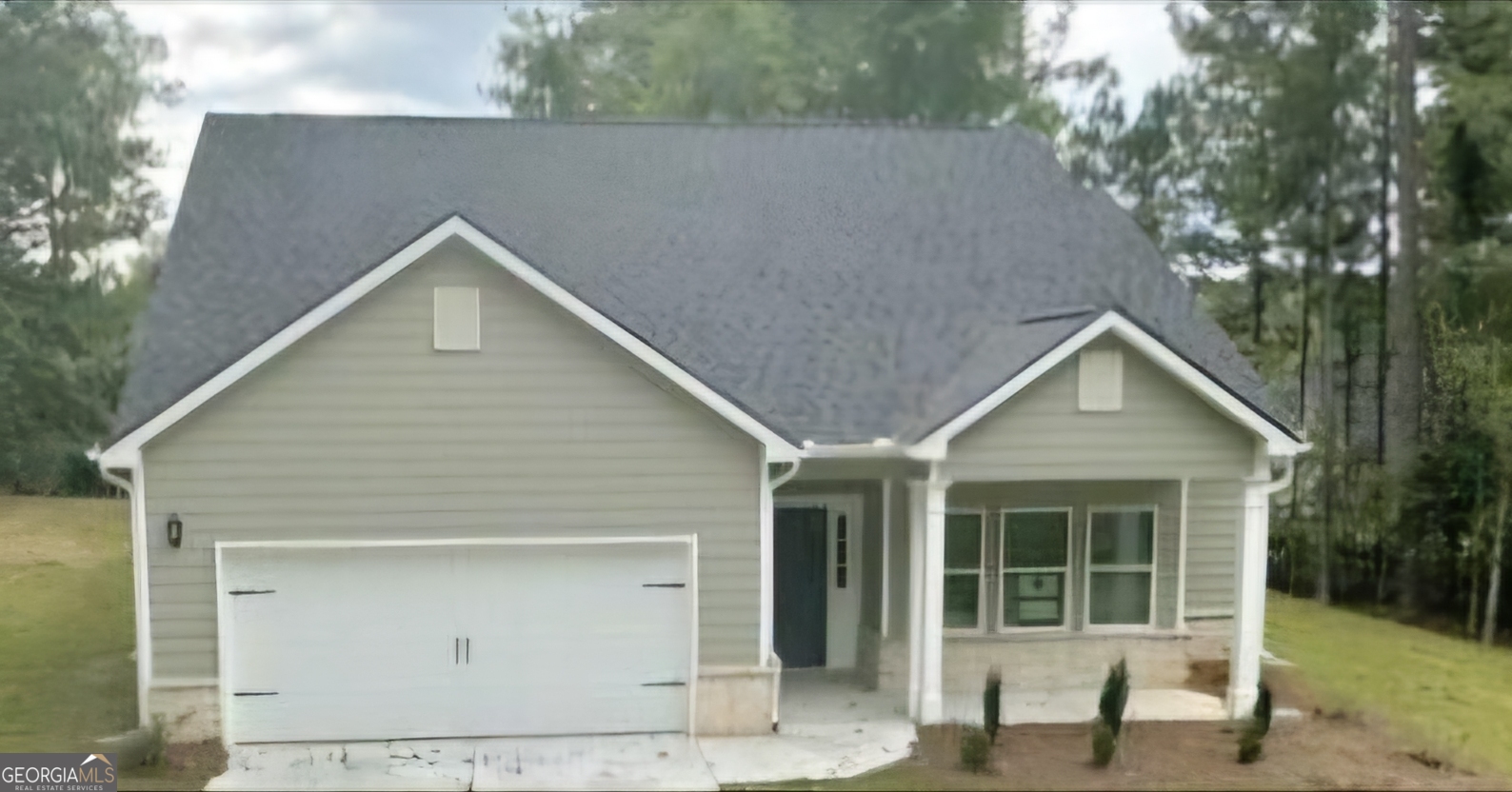 a view of outdoor space yard and garage