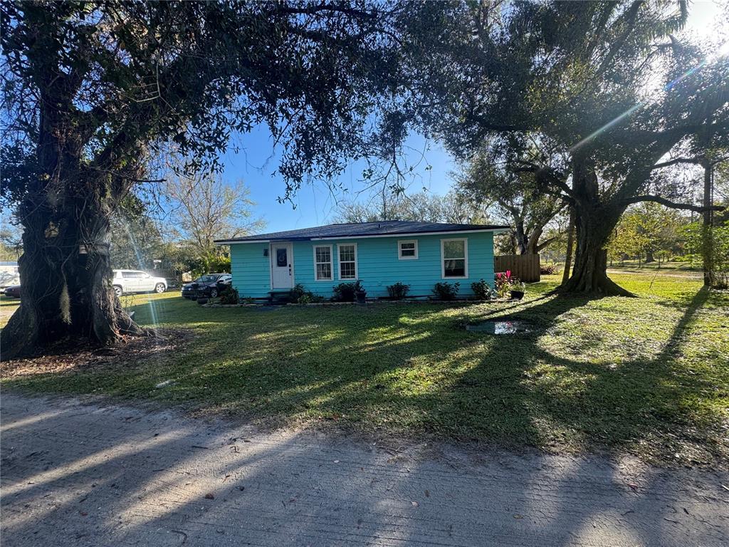 a view of a house with a yard