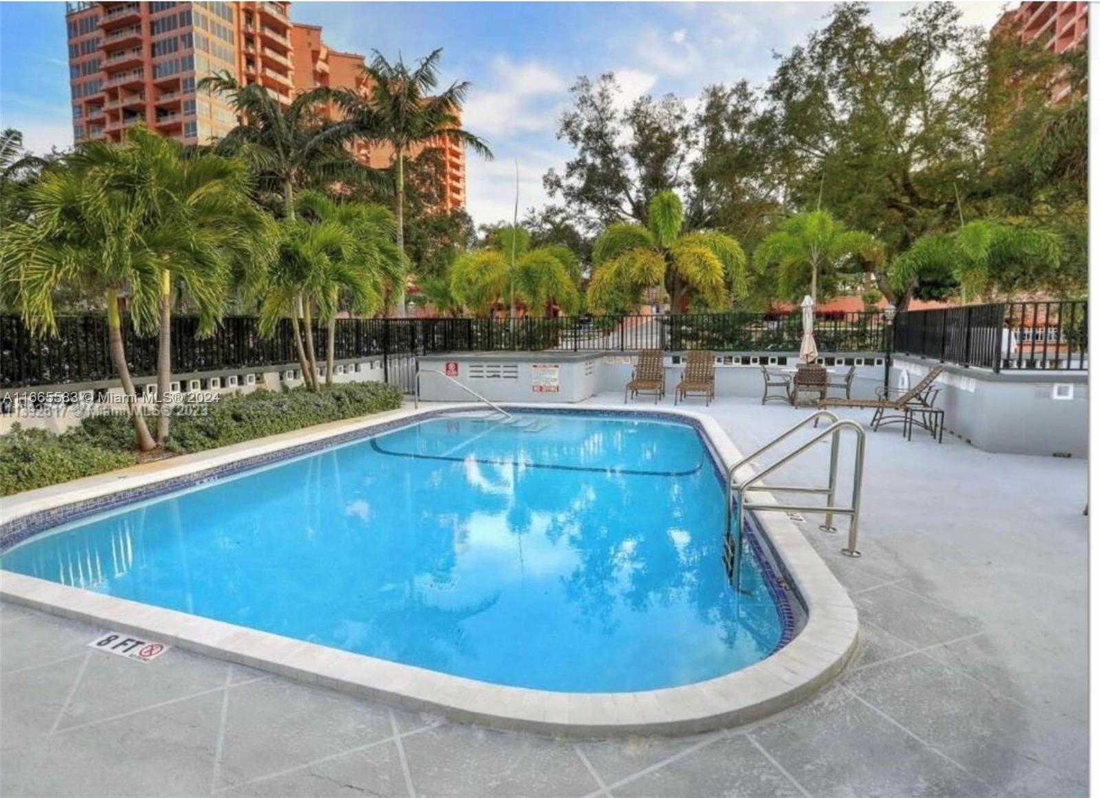 a view of a swimming pool with a patio