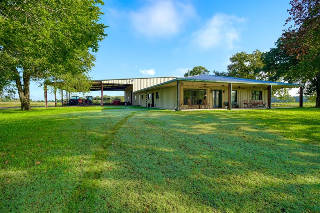 a view of a house with a big yard