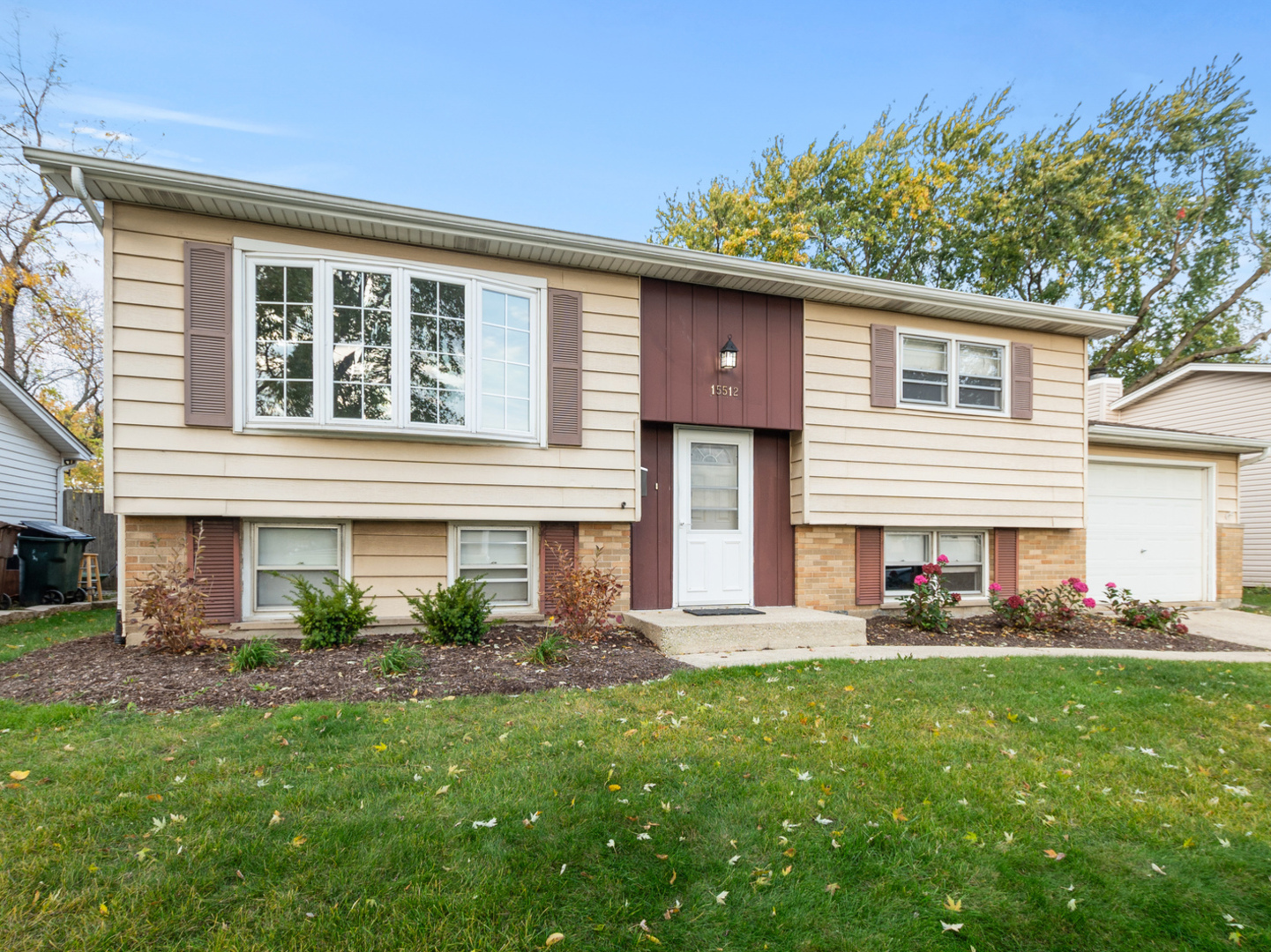 a front view of house with yard and outdoor seating