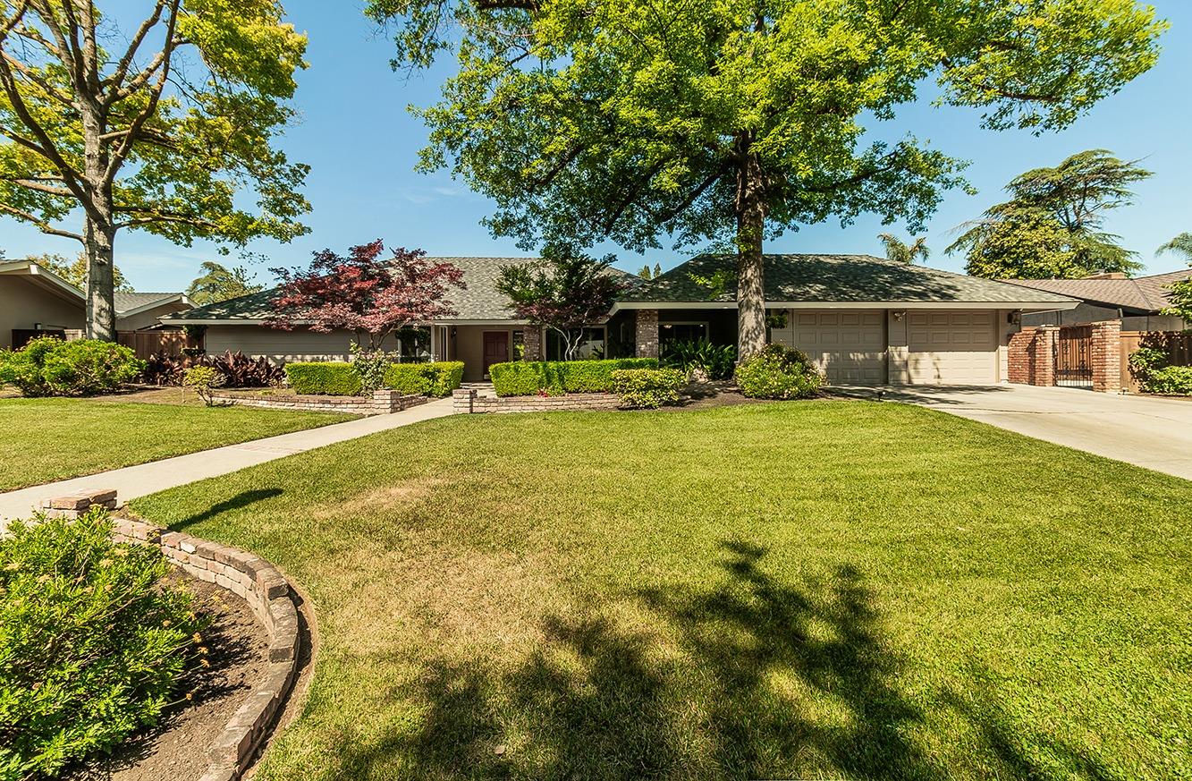 swimming pool with outdoor seating and yard