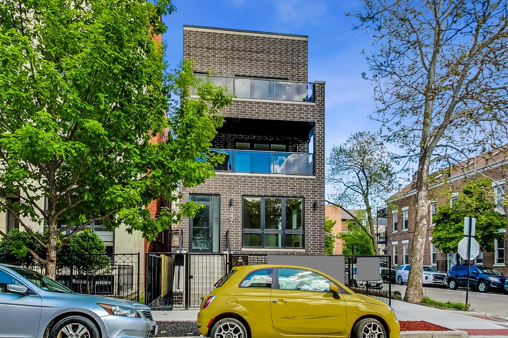 front view of a house with car parked