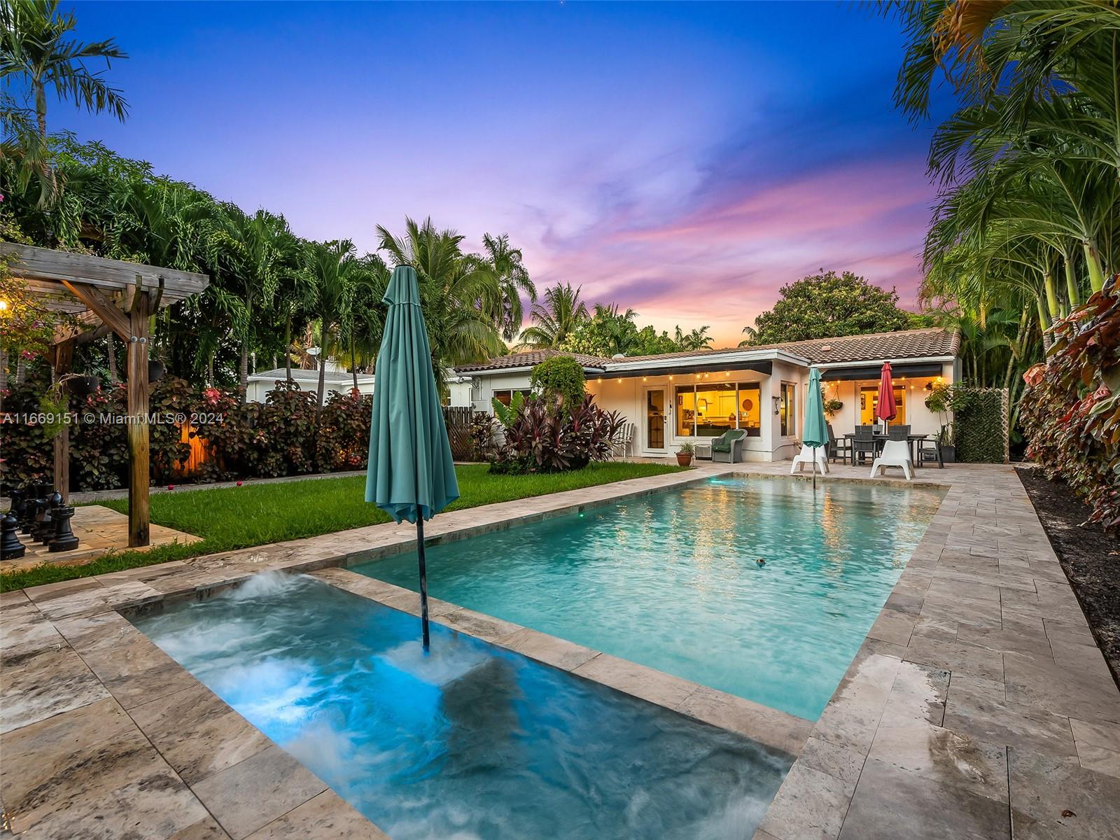 a view of a swimming pool with a patio