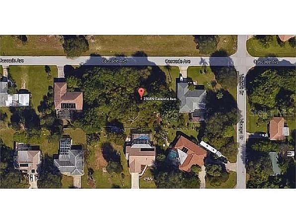 an aerial view of houses with outdoor space