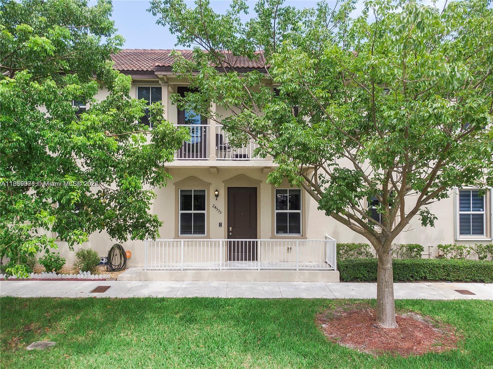 a front view of a house with a yard