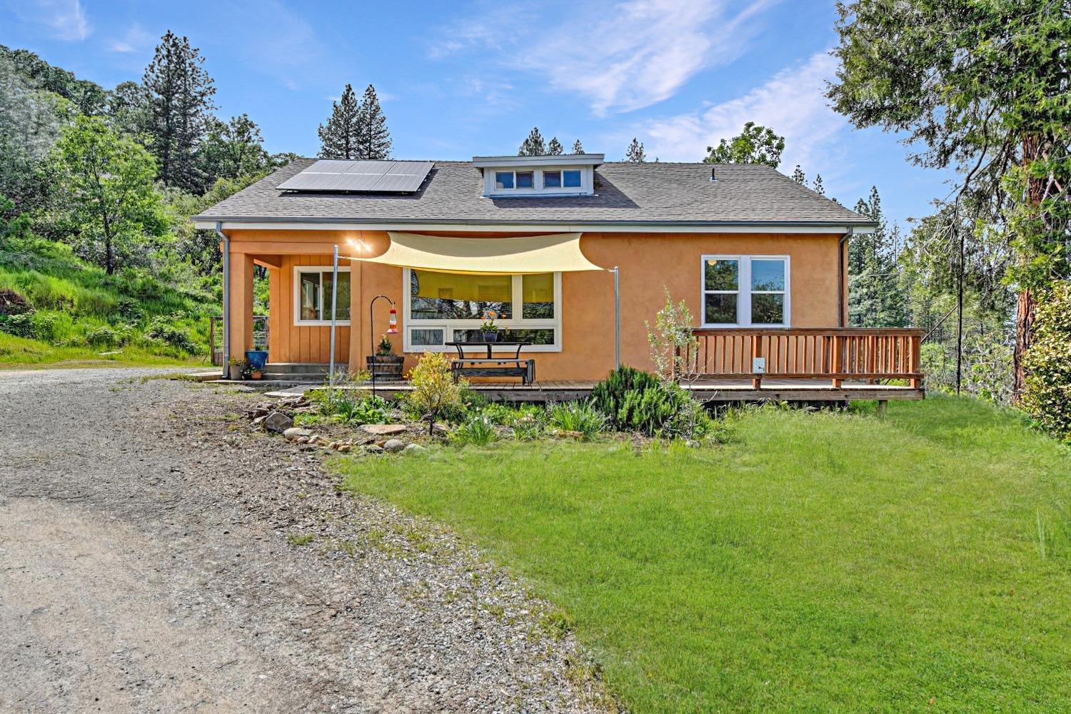 a front view of a house with garden