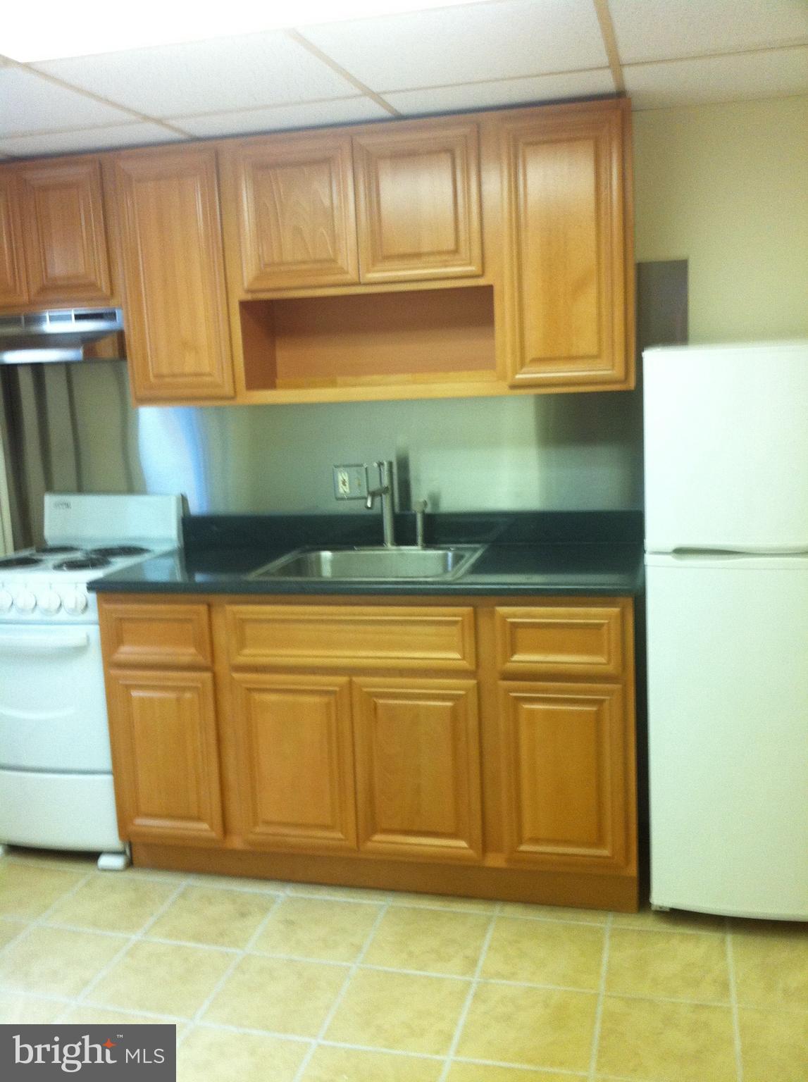 a kitchen with granite countertop cabinets and a stainless steel appliances